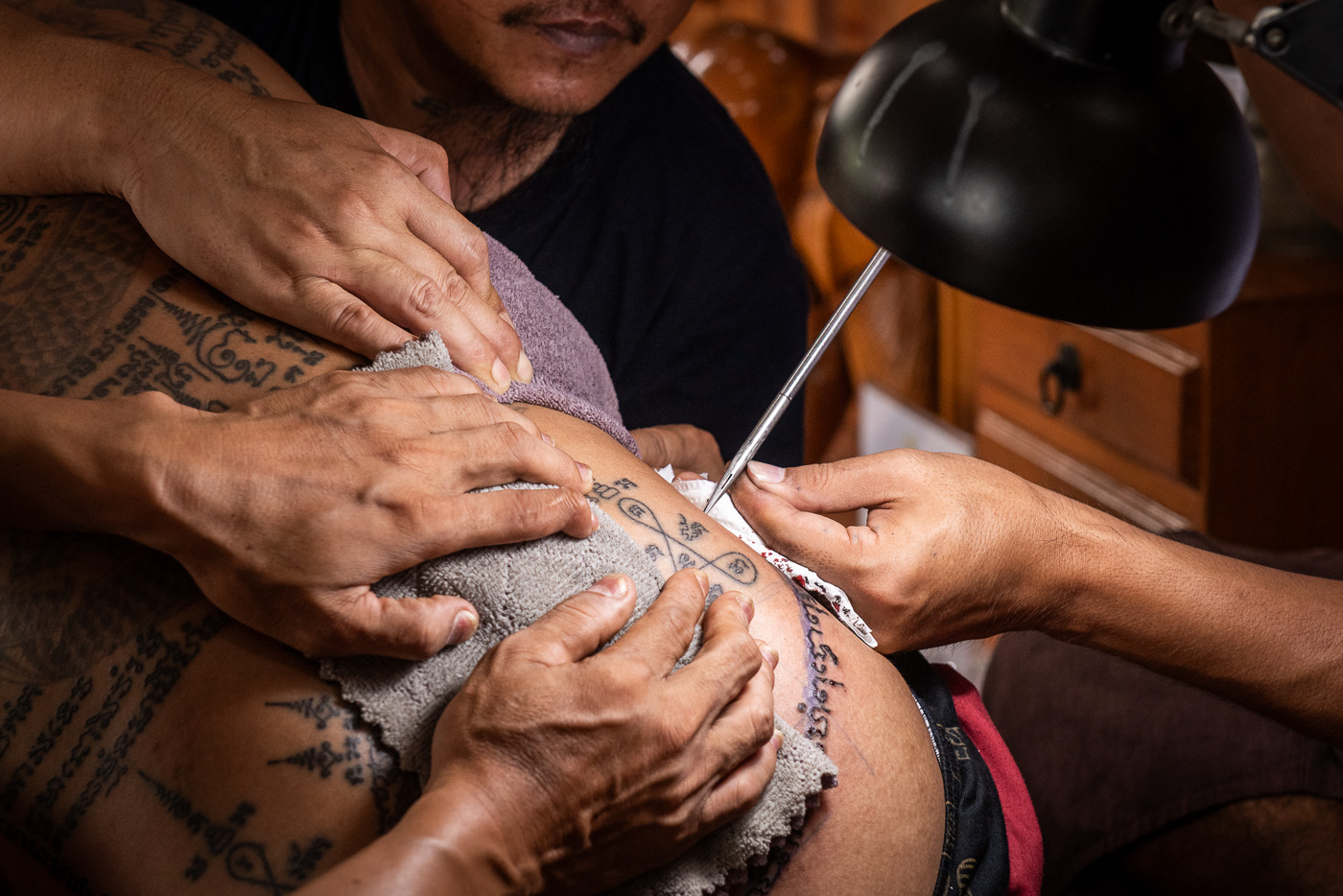 Sak Yant tattooing in progress