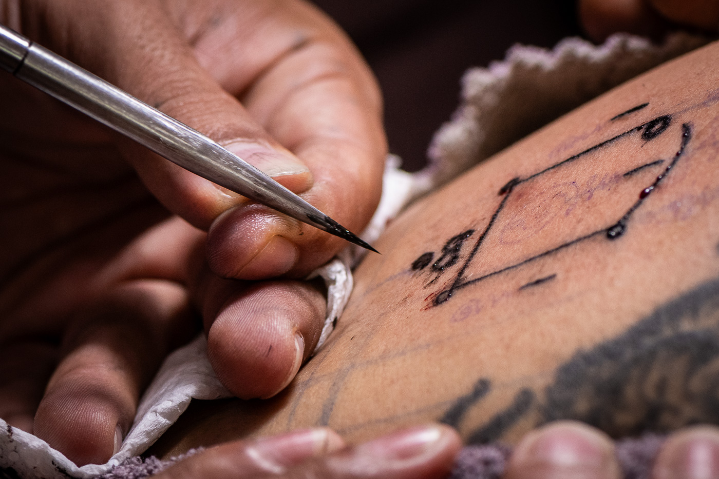 Sak Yant tattooing detail