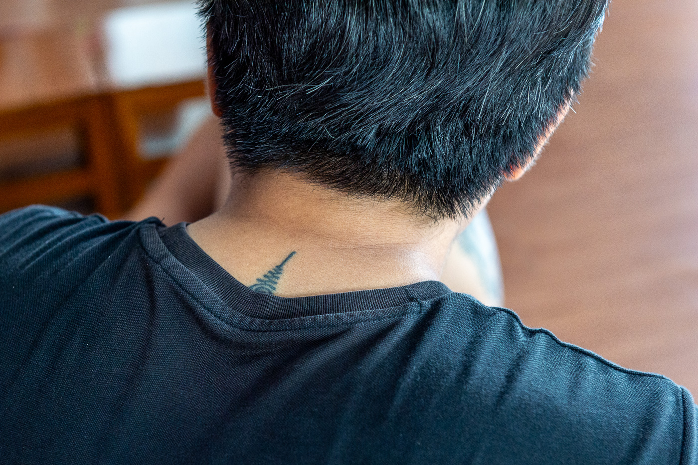 Sak Yant tattoo on neck